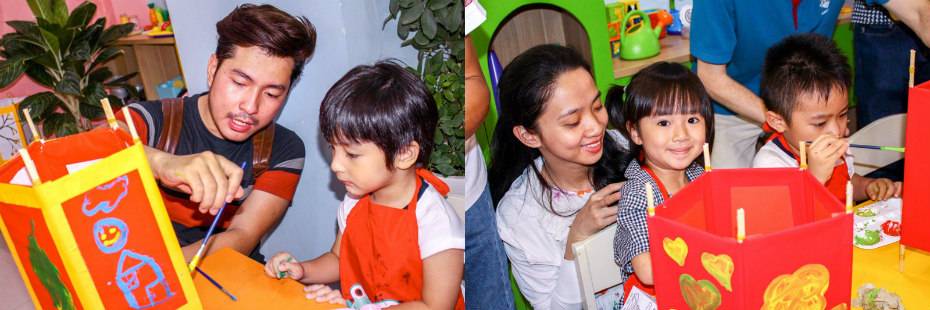 Trẻ cùng bố mẹ trang trí lồng đèn Trung Thu